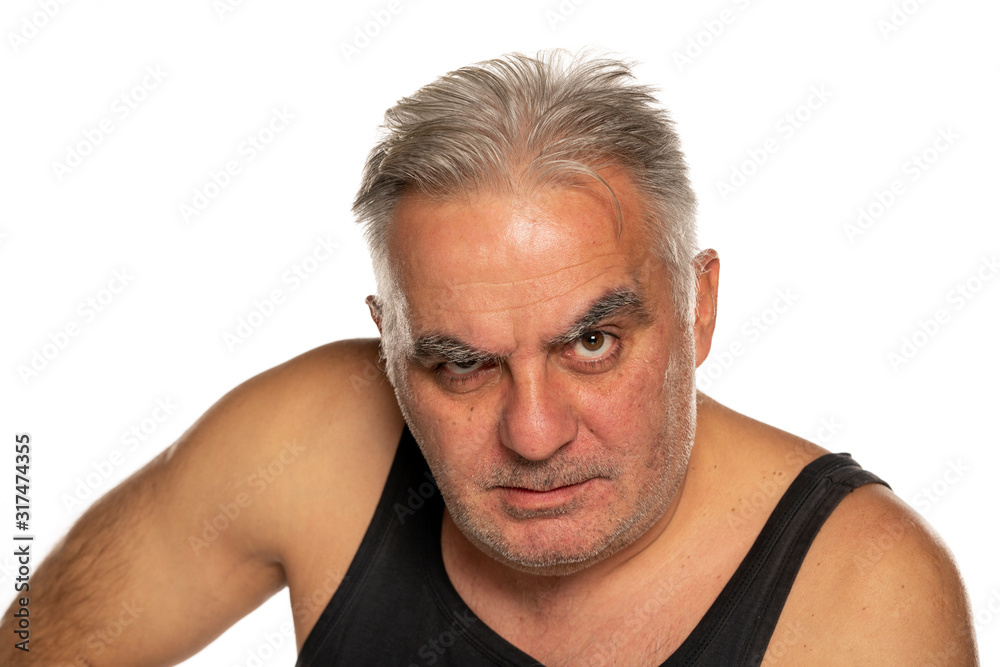 middle aged angry man with short gray hair on white background middle aged angry man with short gray hair on white background