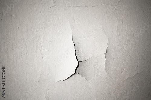 Cracks on a white plastered wall