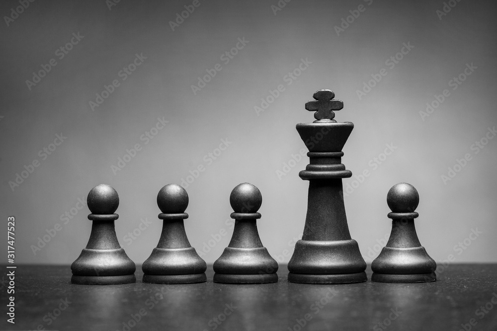Black king chess piece with four pawns Stock Photo | Adobe Stock