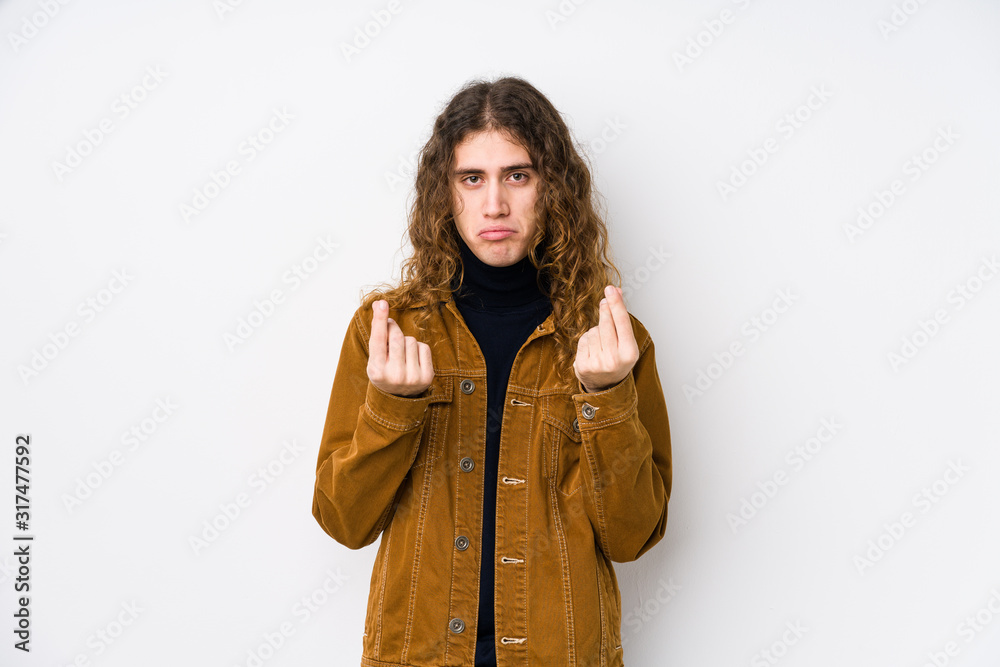 Long hair man posing isolated showing that she has no money. Long hair man posing isolated showing that she has no money.