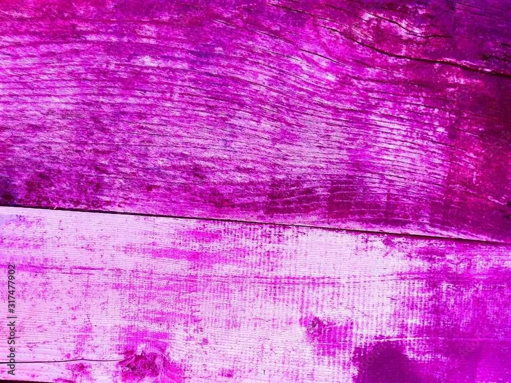 Obraz premium Purple pink rustic wooden wall texture background. Close-up wall wooden rustic plank panel or board as purple texture background. Old grunge purple wooden rustic wall. Vintage paint wood plank texture