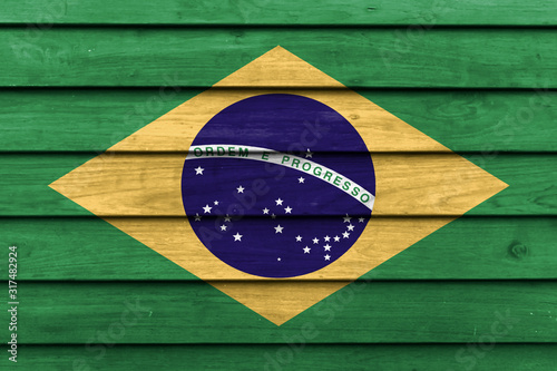 Brazil national flag painted on wood background.
