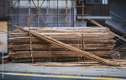 Obraz na płótnie Bamboo poles for scaffolding on building construction site