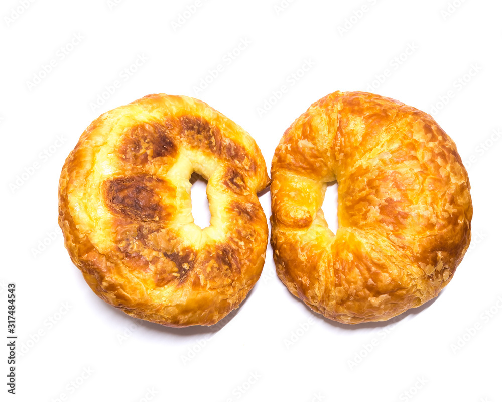 Studio shot two fresh baked French butter croissant isolated on white