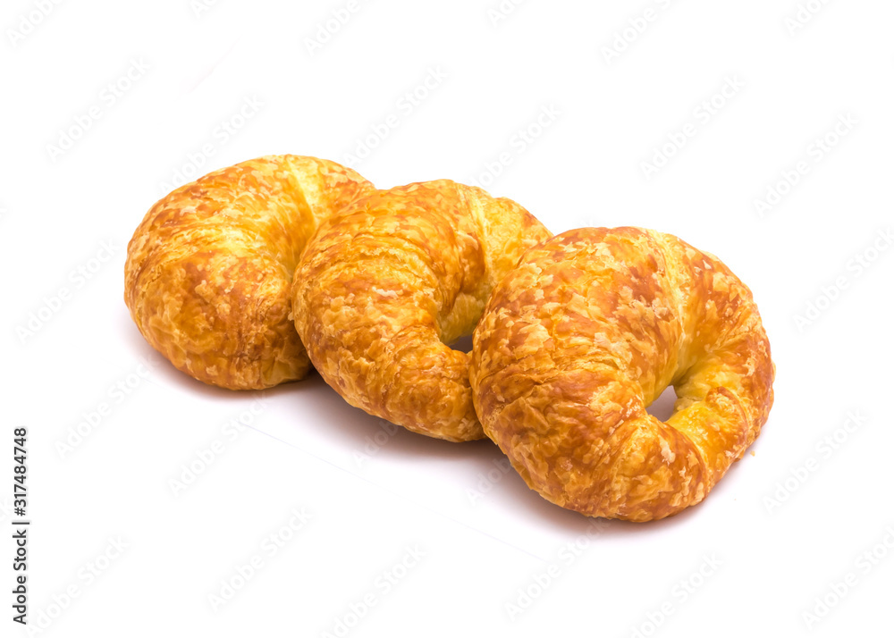 Studio shot three fresh baked French butter croissant isolated on white