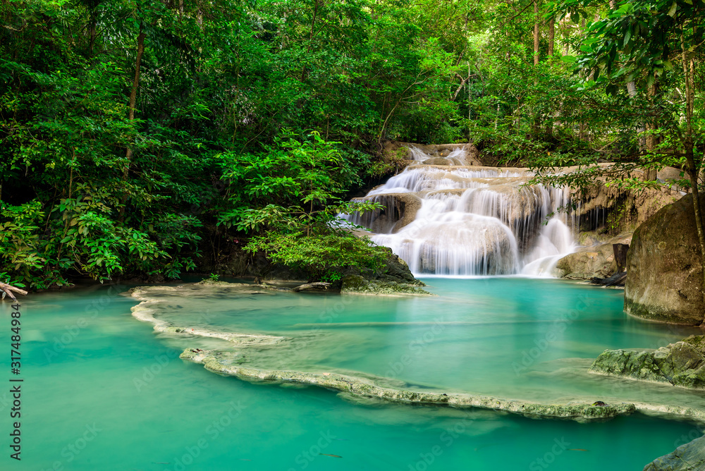 Waterfall in Tropical forest at Erawan waterfall National Park, Thailand Waterfall in Tropical forest at Erawan waterfall National Park, Thailand