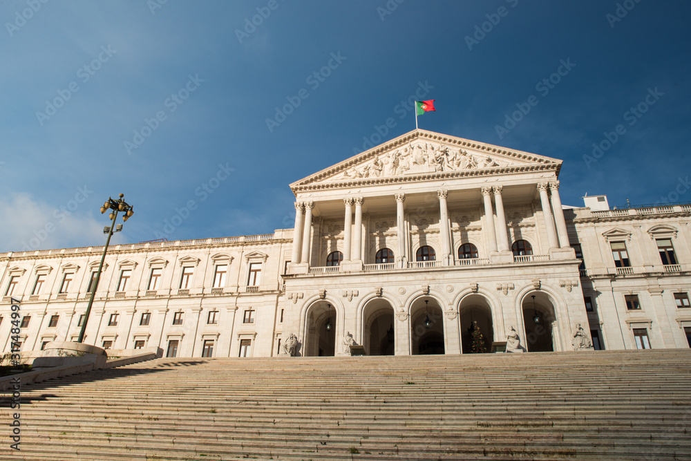 White building Portuguese Parliament, Sao Bento Palace in Lisbon with blue sky on the background