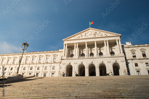 Fototapeta Naklejka Na Ścianę i Meble -  White building Portuguese Parliament, Sao Bento Palace in Lisbon with blue sky on the background