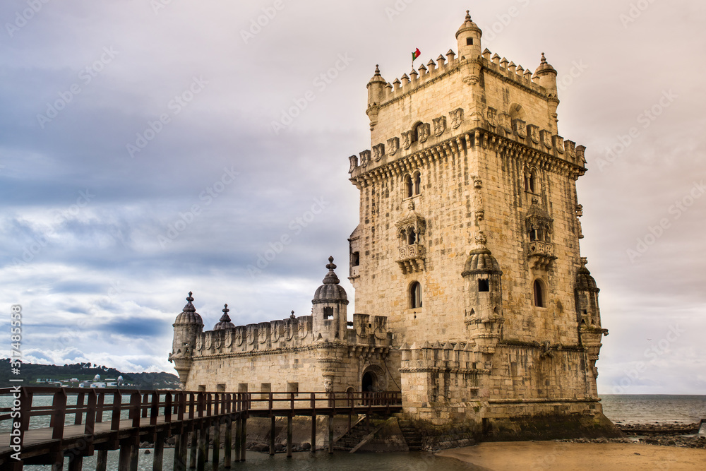 Obraz premium Lisbon, Belem Tower - Tagus River, Portugal one of the most famous attractions of Portugal, iconic monument built as a defense tower.