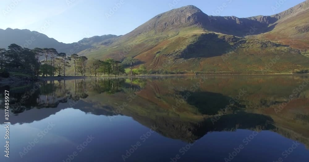 The Lake Buttermere pines and peaks of High Crags, Lake District National Park, Cumbria, England, United Kingdom, Europe The Lake Buttermere pines and peaks of High Crags, Lake District National Park, Cumbria, England, United Kingdom, Europe
