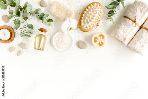 Obraz Spa concept with eucalyptus oil and eucalyptus leaf extract natural /organic spa cosmetics products, eco friendly bathroom accessories. Skincare concept on white background. Flat lay composition 