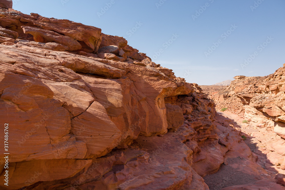 Coloured Canyon is a rock formation on South Sinai (Egypt) peninsula. Desert rocks of multicolored sandstone background.