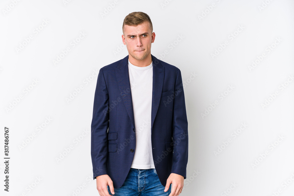 Young business caucasian man confused, feels doubtful and unsure. Young business caucasian man confused, feels doubtful and unsure.