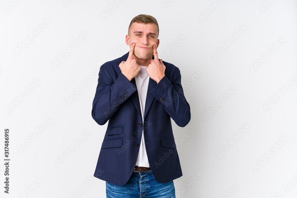 Young business caucasian man doubting between two options. Young business caucasian man doubting between two options.