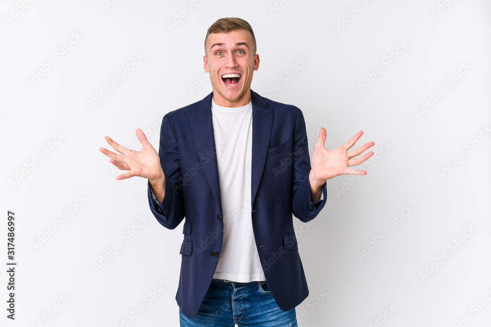 Young business caucasian man celebrating a victory or success, he is surprised and shocked. Young business caucasian man celebrating a victory or success, he is surprised and shocked.