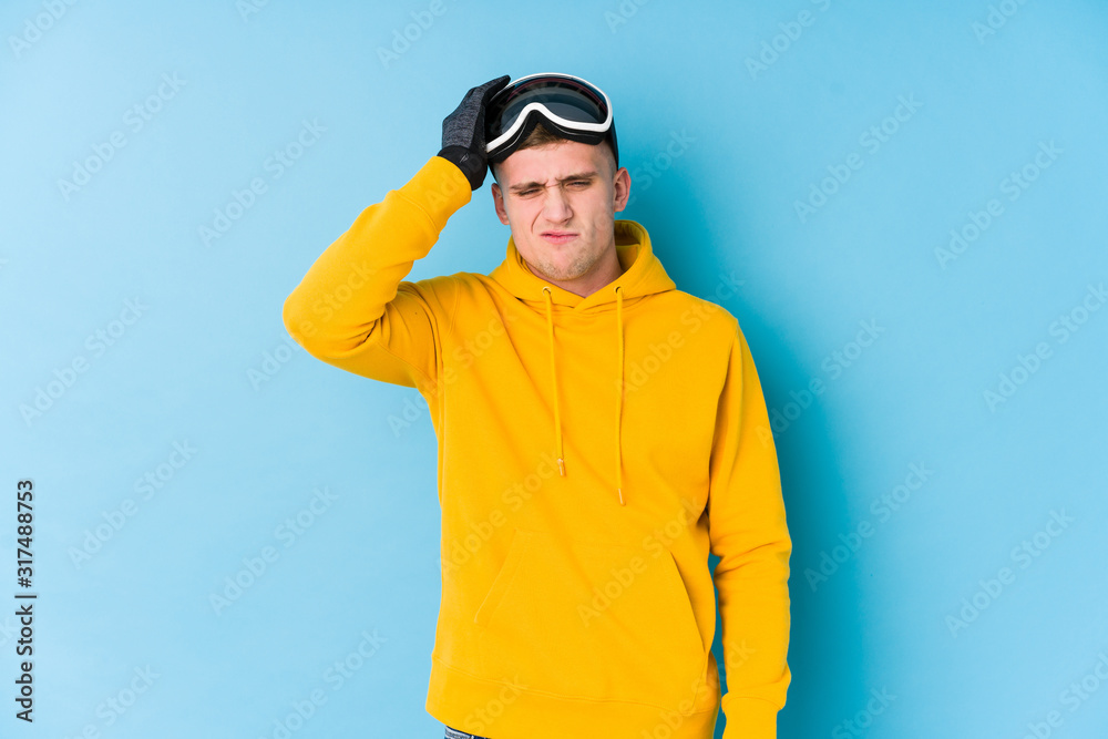 Young skier man being shocked, she has remembered important meeting. Young skier man being shocked, she has remembered important meeting.