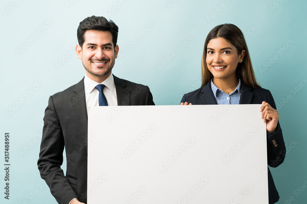 Male And Female Business Colleagues In Studio Male And Female Business Colleagues In Studio