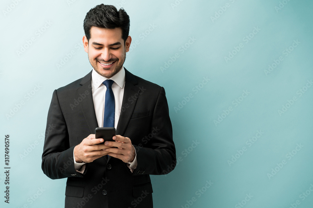 Young Male Professional Surfing On Smart Phone Young Male Professional Surfing On Smart Phone