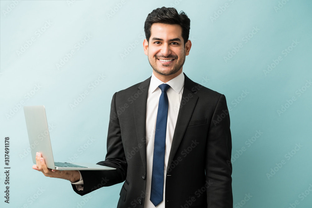 Confident Male Executive With Wireless Technology Confident Male Executive With Wireless Technology