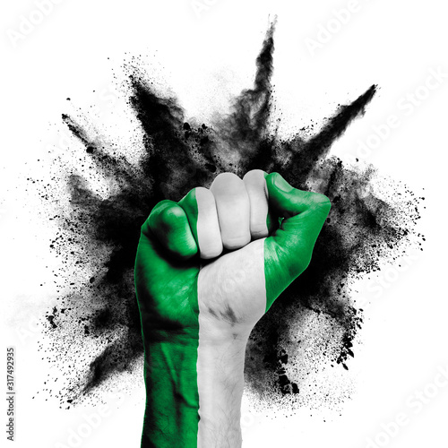 Nigeria raised fist with powder explosion, power, protest concept photo