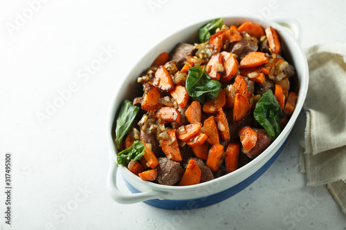 Roasted beef with carrot and green basil