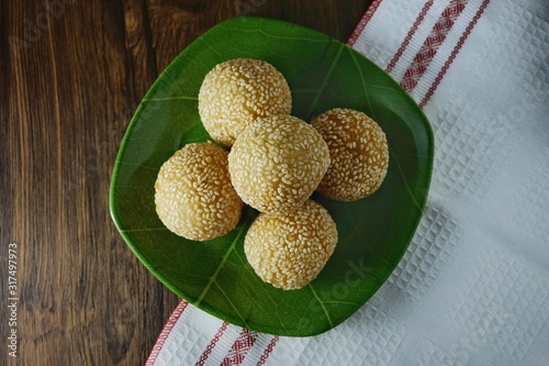 Onde-onde is a popular snack food in Indonesia.  Made from glutinous rice flour with green beans as the filling and covered with sesame. photo