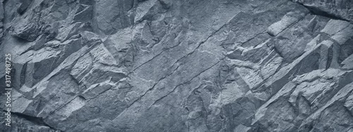 Obraz  z motywem Gray grunge banner. Abstract stone background. The texture of the stone wall. Close-up. Light gray rock backdrop.