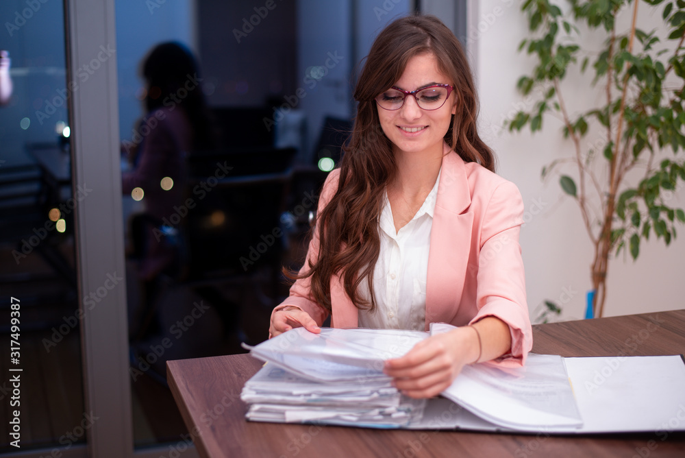 Young woman with glasses in the office 