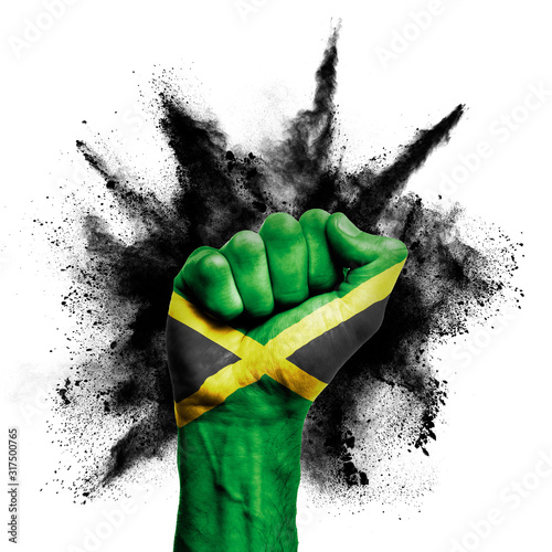 Fototapeta Jamaica raised fist with powder explosion, power, protest concept