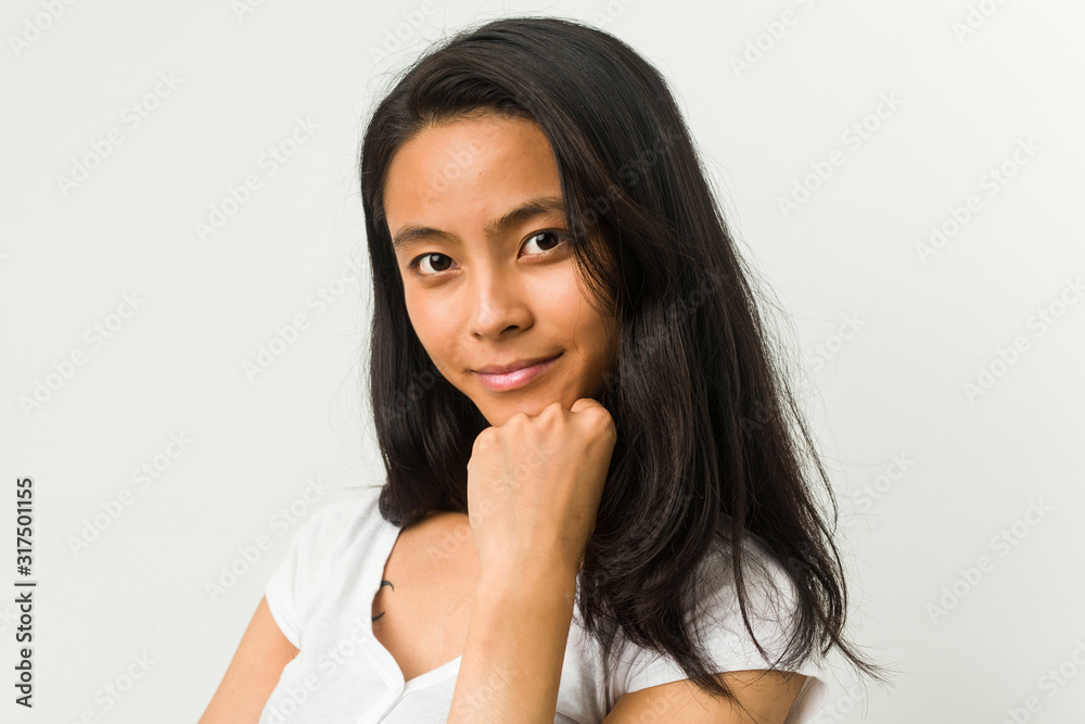 Young chinese woman posing on a white background Young chinese woman posing on a white background
