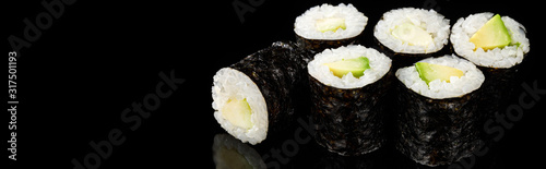 delicious sushi maki with avocado isolated on black, panoramic shot