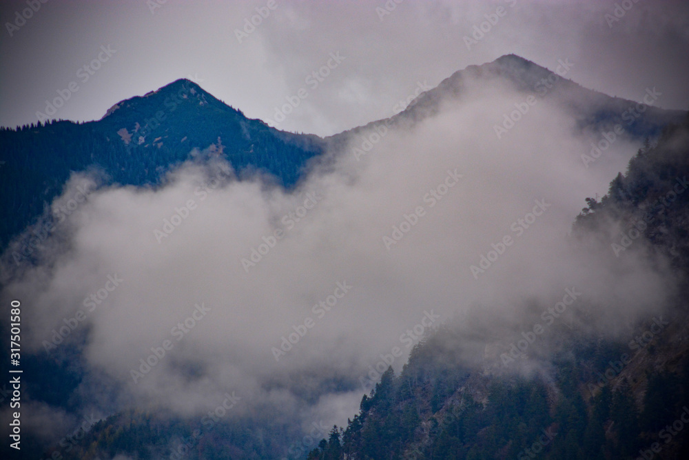 Alps Alpine Landscape near Reutte in Austria with mist