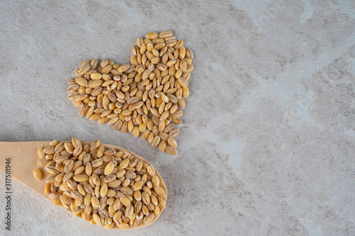 The heart is made of spelt grain, a healthy food concept.