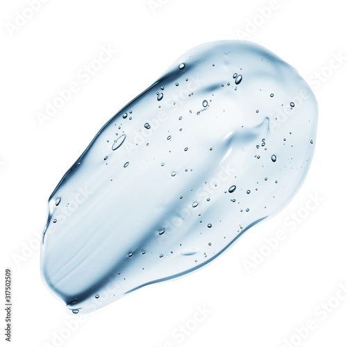 Transparent clear blue liquid serum gel smudge with bubbles isolated on white background photo