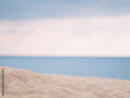 Closeup of sand with sea background