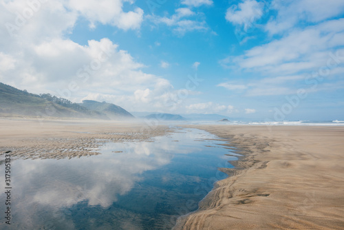 Empty sandy beach during ebb