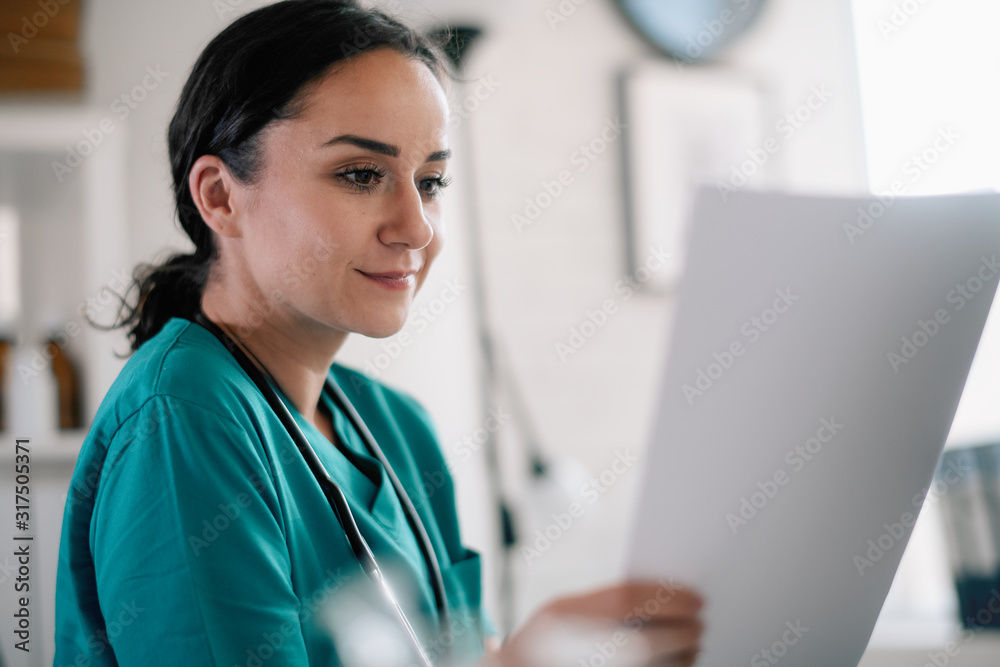 Young beautiful doctor in medical office. Female doctor working on analysis. Young beautiful doctor in medical office. Female doctor working on analysis.