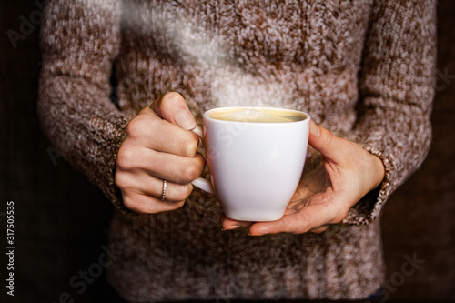 female hands and coffee