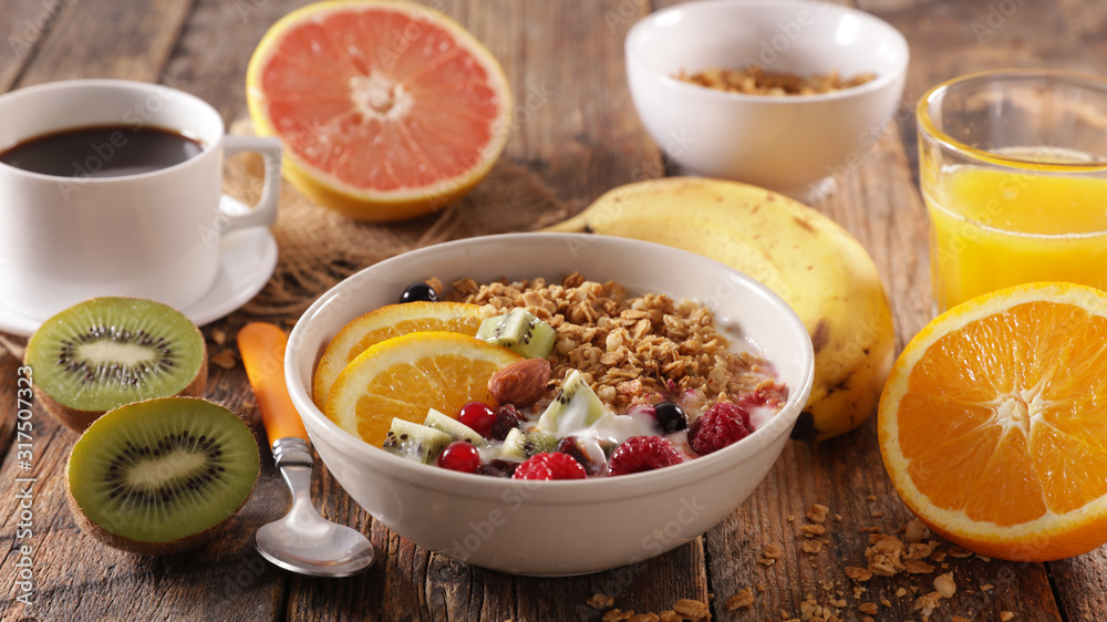 muesli with yogurt and fruit, orange juice and coffee cup muesli with yogurt and fruit, orange juice and coffee cup