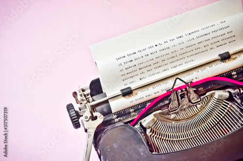 Antique Typewriter on Pink Background