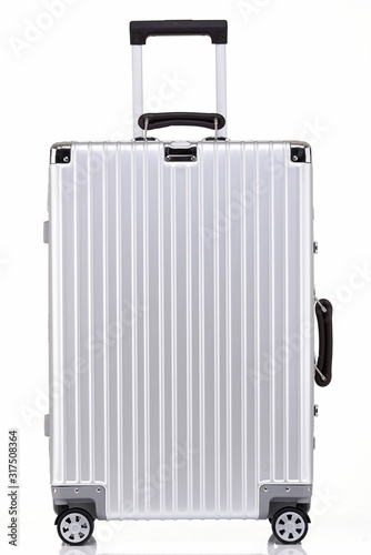 Delicate silver-white metal suitcase against a black background