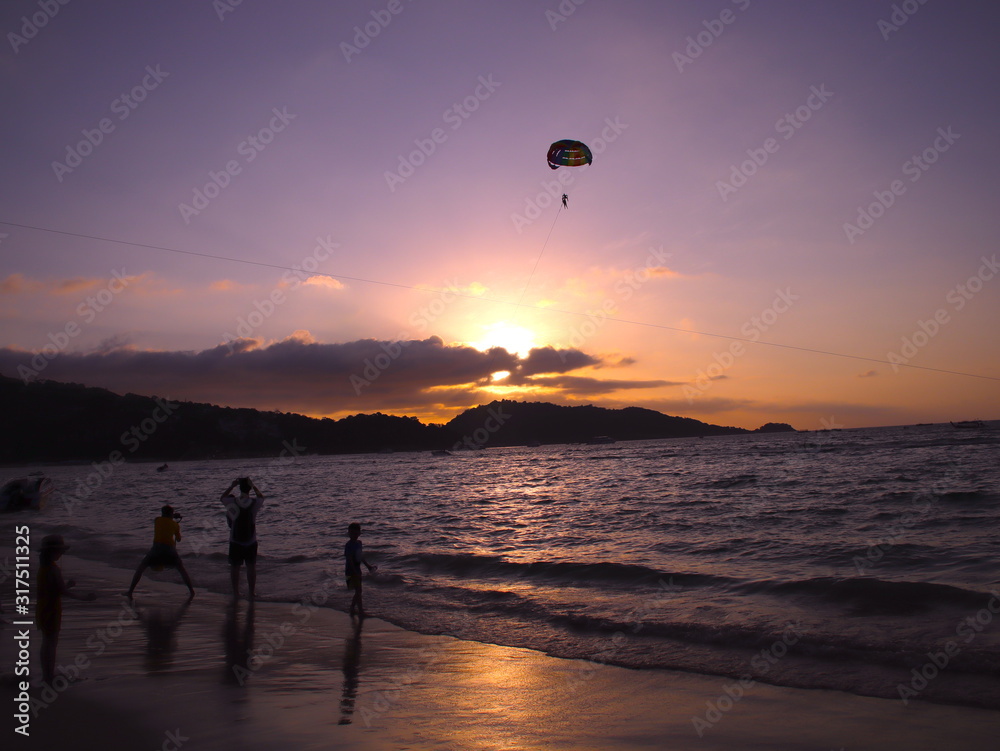 Parasailing at Patong Phuket Thailand at Sunset beautiful colours