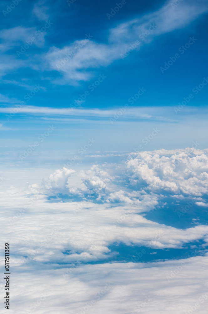 sky seen from an airplane window with lots of clouds and contrasting colors sky seen from an airplane window with lots of clouds and contrasting colors