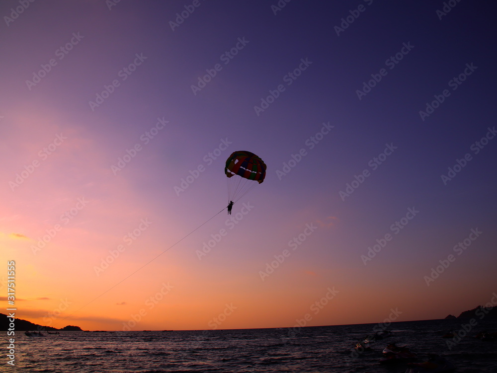 Parasailing at Patong Phuket Thailand at Sunset beautiful colours