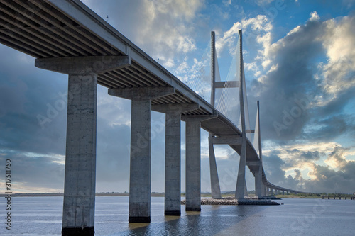 A new concrete and suspension bridge spanning a waterway © dbvirago