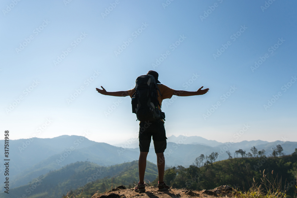 Silhouette of a man enjoying the mountain