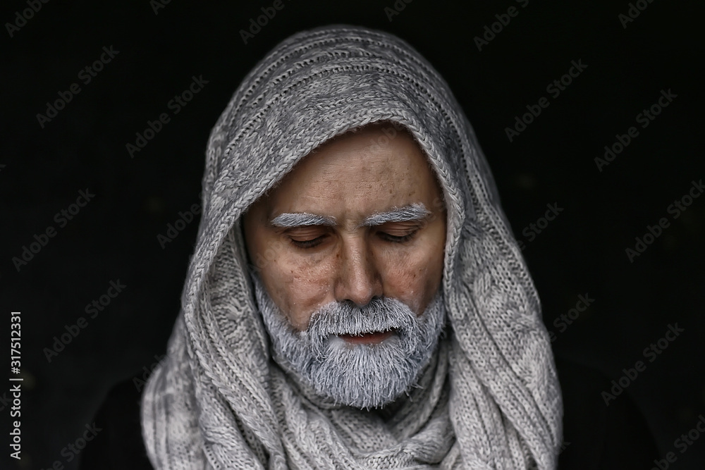make-up man with a beard / concept oriental portrait in traditional dress, gray-haired white beard in an Arab man make-up man with a beard / concept oriental portrait in traditional dress, gray-haired white beard in an Arab man