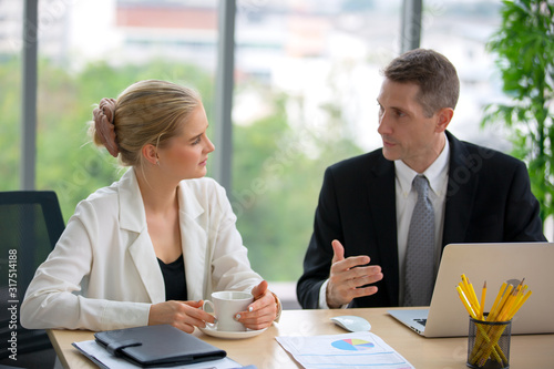 Young passionate businesswoman explaining her idea in the meeting room