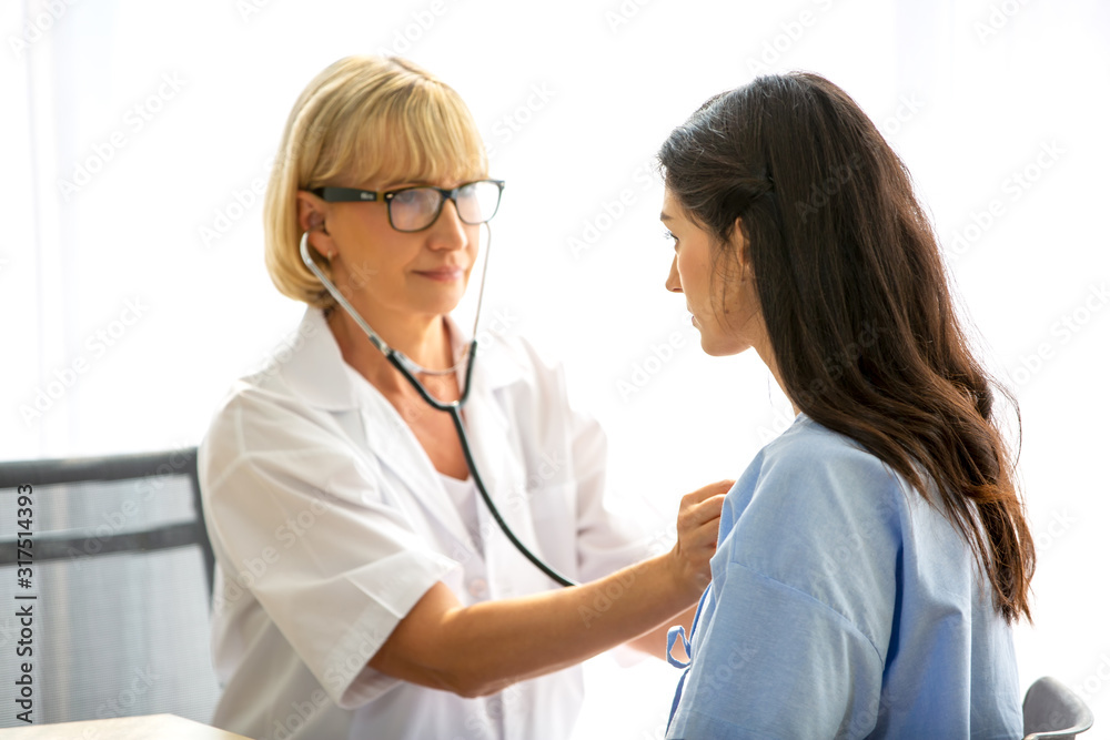 doctor talk with women patient in hospital doctor talk with women patient in hospital