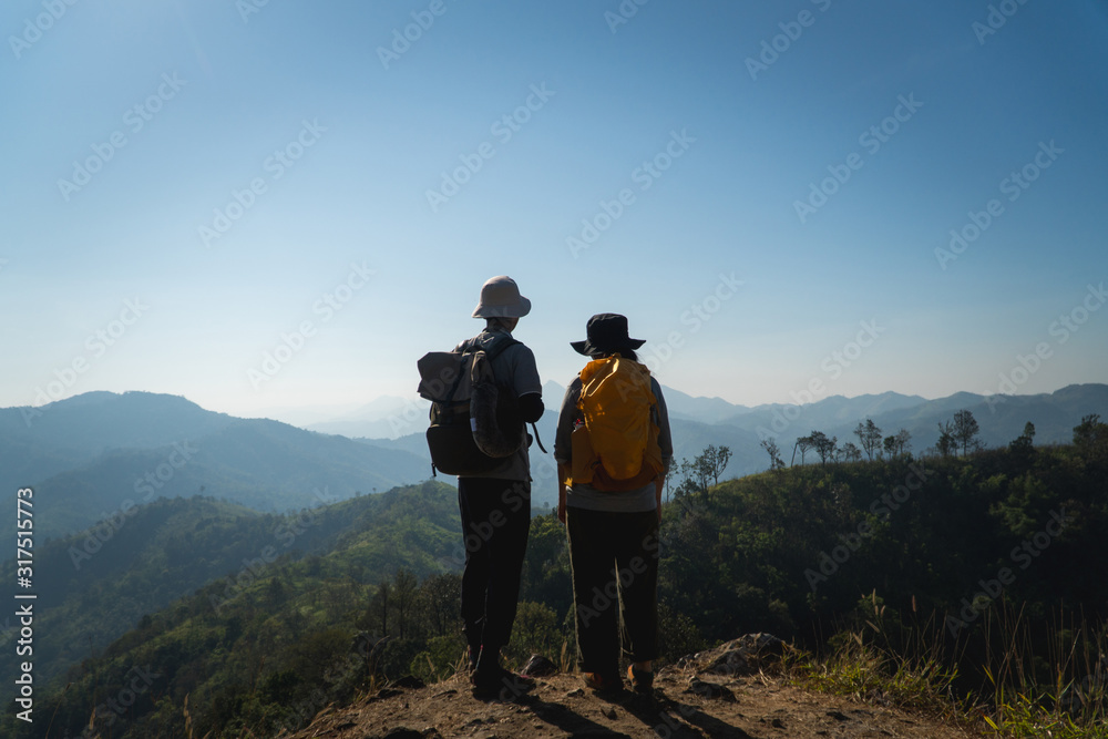 Fototapeta premium Rear of couple over looking the mountain